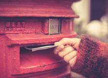 Letters being put in the postbox