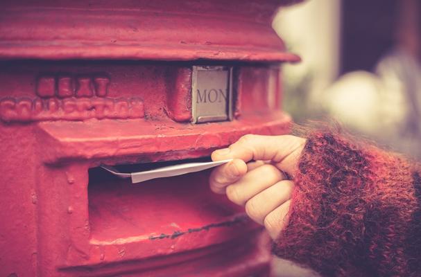 Letters being put in the postbox