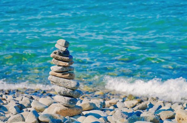 Balancing stones on a beach