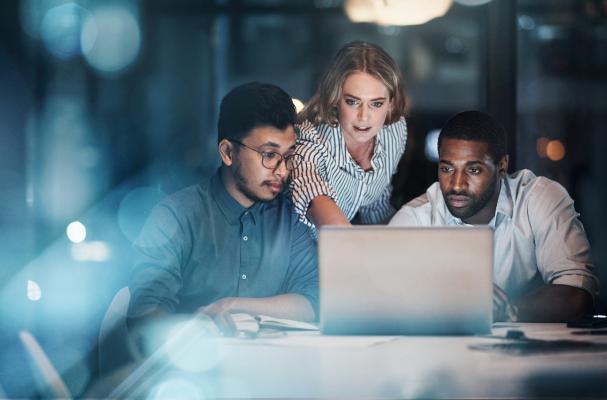 Fundraising team looking at laptop