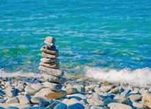 Balancing stones on a beach