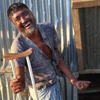 Leprosy Mission man with crutch