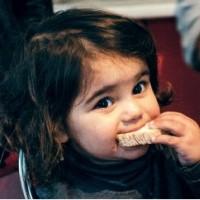 Mission Without Borders child with bread gift